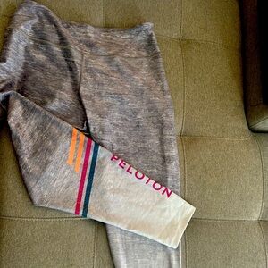 Brand new, never worn Peloton 3/4 length leggings with logo on one leg